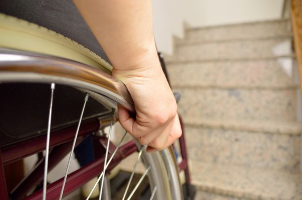 Disabled woman awarded £9k after unsuitable housing left her having to 'drag herself upstairs using her hands'